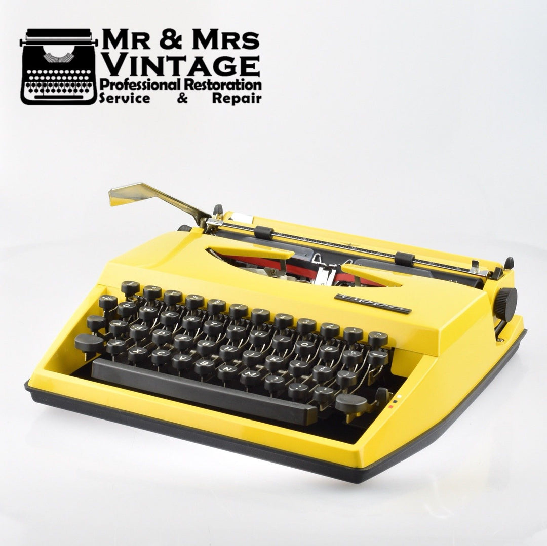 Adler Tippa Typewriter | Yellow | Portable | WORLDWIDE POSTAGE